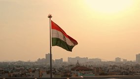 Drone shot of Indian flag waving in sky bon a windy day during sunset. - Powered by Shutterstock - Get 15% off with code: PIKWIZARD15