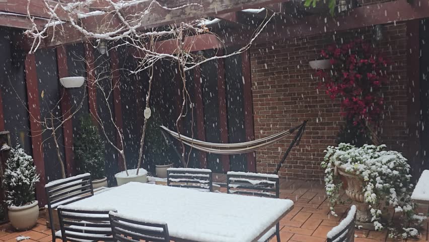 Garden snowy patio after snowfall winter scenery.