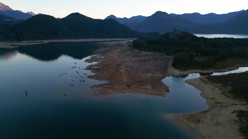 Sunset Over Mountain Lake and Sandy Beach in British Columbia, Canada