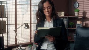 Thoughtful puzzled Caucasian woman holding reading notebook notes female girl businesswoman in office indoors manager planning business tasks creative worker thinking ponder ideas solution employer - Powered by Shutterstock - Get 15% off with code: PIKWIZARD15