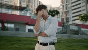 Sad Caucasian man problem crisis job loss feel pain despair male guy businessman city frustrated depressed headache stress worried upset employer student work bankruptcy health tired outdoors business - Powered by Shutterstock - Get 15% off with code: PIKWIZARD15