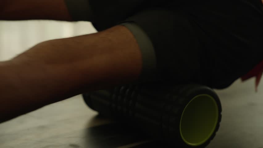 Man Foam Rolling Thigh Massage