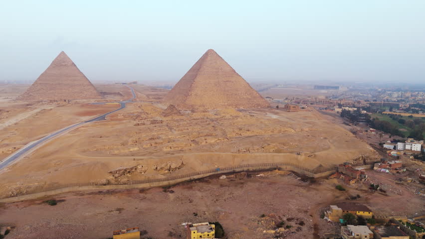 Giza Pyramids On Giza Plateau In Greater Cairo, Egypt - Aerial Drone Shot