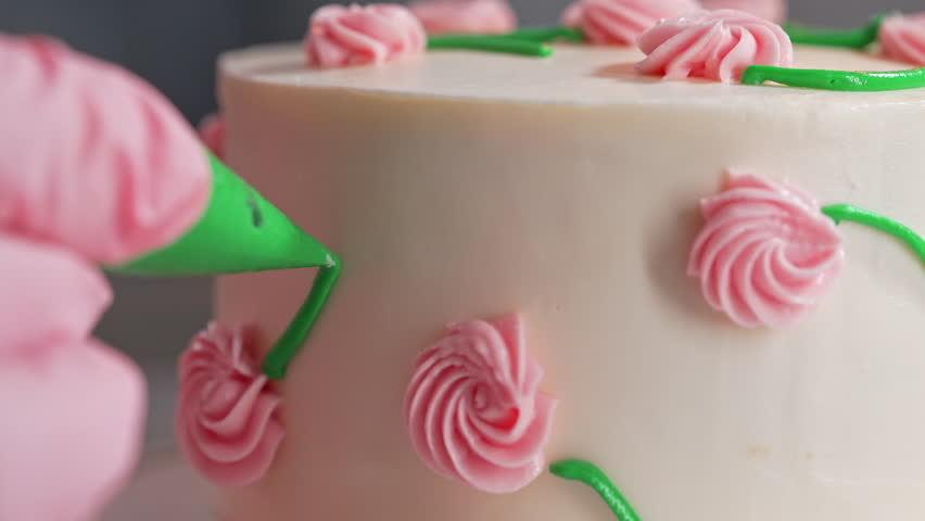Chef Hands Decorating Bento Cake with Cream Roses. Pastry Art, Floral Details.