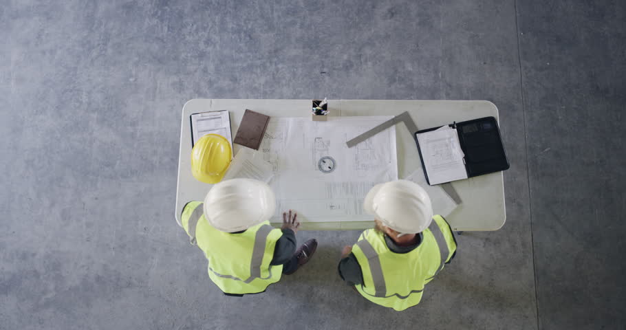 Angry, table or men with engineering mistake in meeting with failure, building crisis or project error. Stress, flip or rage of furious contractor with loss, burnout or teamwork in construction site