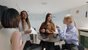 A vibrant scene shows diverse professional women engaged in meaningful interactions in an office, highlighting the importance of teamwork and collaboration for success in their fields - Powered by Shutterstock - Get 15% off with code: PIKWIZARD15