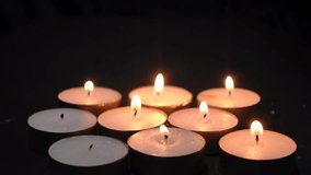 Lighting Tealight Candles Illuminated in Darkness Creating a Serene and Peaceful Ambiance - Powered by Shutterstock - Get 15% off with code: PIKWIZARD15