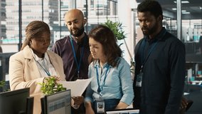 Portrait of smiling workers in office working together on finishing project before deadline, doing brainstorming. Team of upbeat office clerks cooperating on tasks, crosschecking documents, camera A - Powered by Shutterstock - Get 15% off with code: PIKWIZARD15