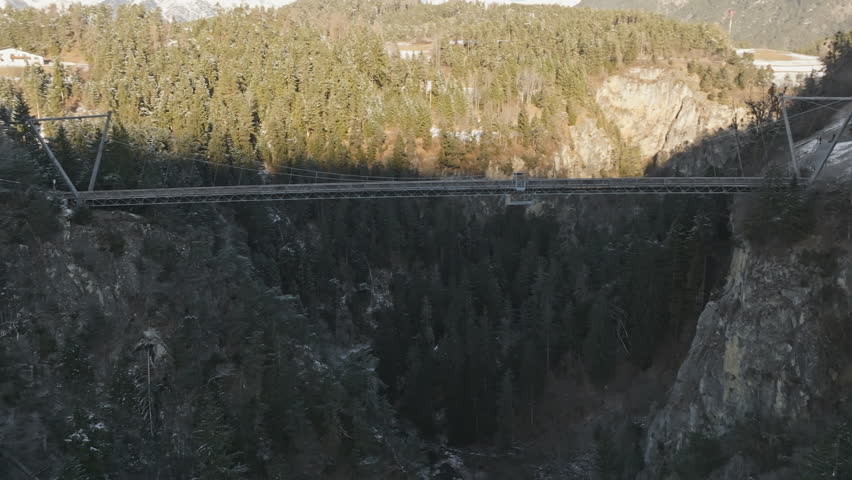 The suspension bridge over the Pitzklamm between Arzl and Wald in the Pitztal in Austria.