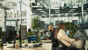 Happy employee starting first day at new job, unpacking belongings, meeting coworkers. Cheerful worker arriving in office, starting work on new company position, being welcomed by team, camera B - Powered by Shutterstock - Get 15% off with code: PIKWIZARD15