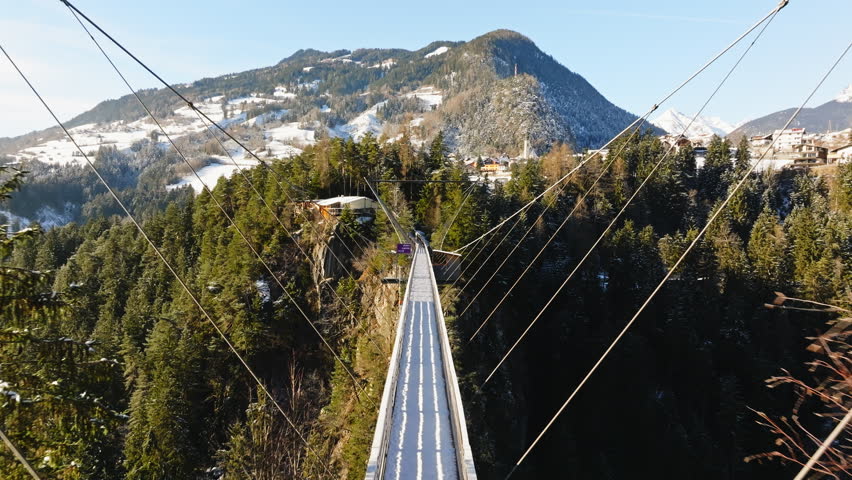 The suspension bridge over the Pitzklamm between Arzl and Wald in the Pitztal in Austria.