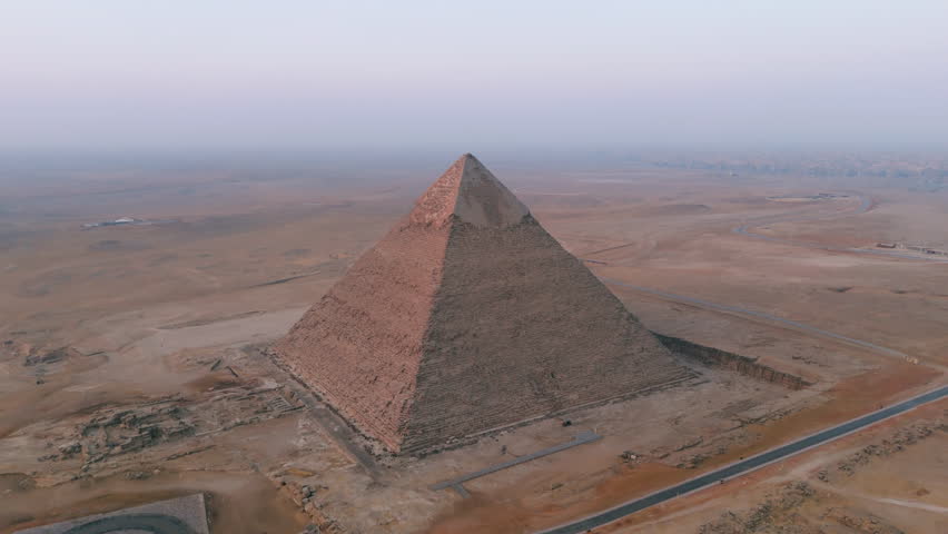 Pyramid Of Khafre On Giza Plateau In Cairo, Egypt. Ancient Egyptian Pyramids Of Giza. aerial tilt-down shot