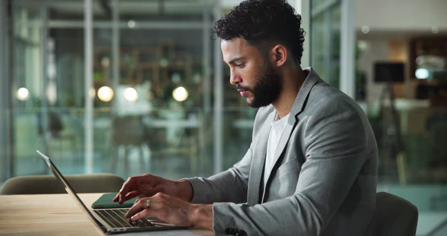Business, laptop and man in office, documents and typing with connection, investment and trading. Financial portfolio, employee and investor with computer, paperwork and internet with online schedule