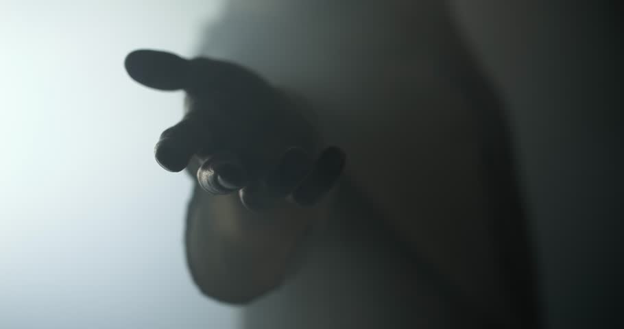 Closeup of the hand of Jesus Christ shrouded in bright light offering his hand for salvation, forgiveness, comfort. Perfect for Christian visual of God's love, the gospel, and Easter resurrection.