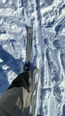 Vertical - POV Of Ski Mountaineer Trekking On Snowy Alps In The Dolomites Of Italy. handheld tilt-up shot