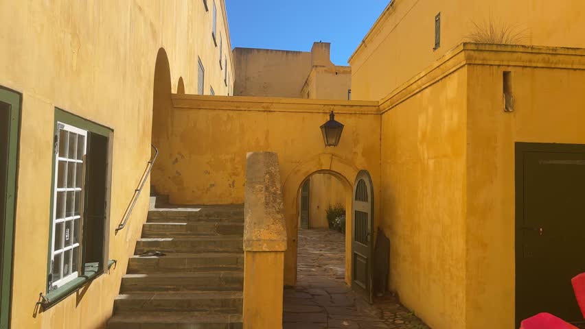 A tracking moving shot of a camera going up the stairs at the Cape Town Castle of Good Hope in Cape Town.
