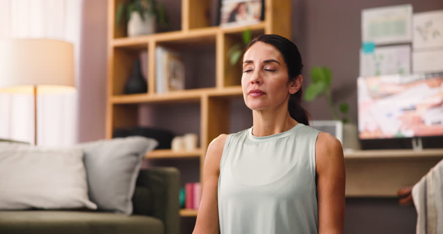 Woman, meditation and zen with breathing exercise in relax for chakra or balance at home. Calm, female person or yogi with namaste, mudra or mantra for spiritual awareness, mindfulness or inner peace