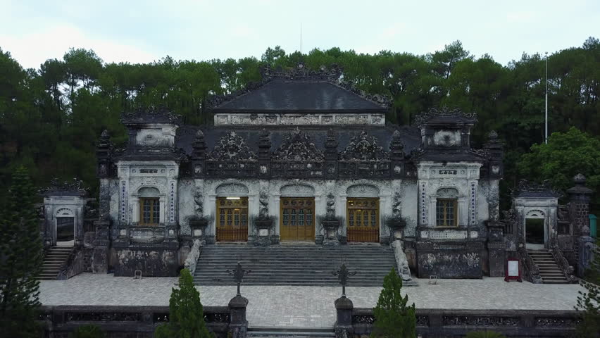 Detailed view of the ornate facade of the Mausoleum of Emperor Khai Dinh in the Hue Imperial City, Vietnam, showcasing its intricate architectural details