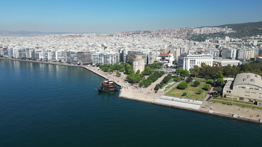 Tourist Boats Dock Near White Tower Of Thessaloniki Greece Drone Track In 4K 60FPS
