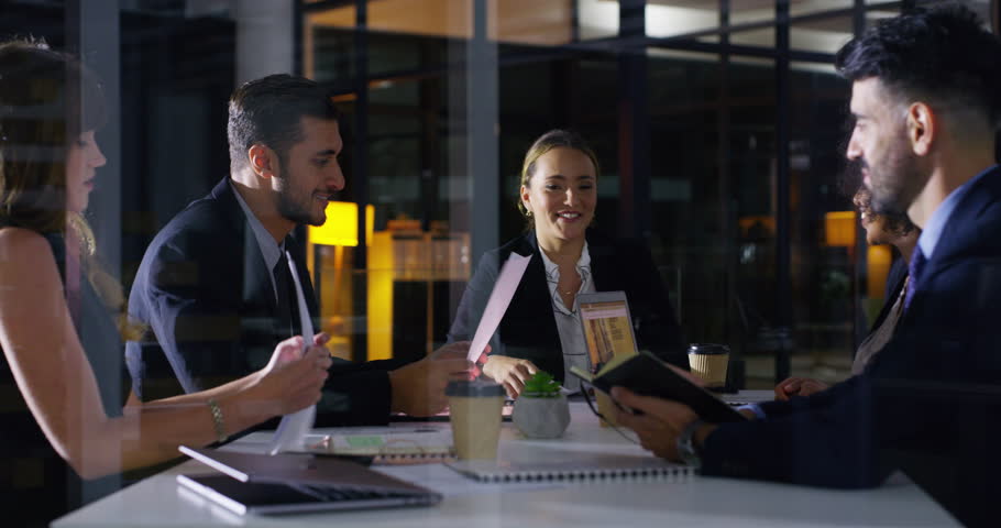 Business people, night meeting and paperwork planning, teamwork and legal proposal in office window. Professional women, men or lawyer team talking, collaboration and documents for law firm strategy