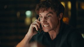 Mad executive yelling in mobile phone at night office closeup. Portrait angry businessman finish displeasing cellphone call at dark workplace. Furious ceo shouting in smartphone frustrated failure. - Powered by Shutterstock - Get 15% off with code: PIKWIZARD15