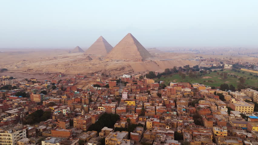 Panorama Of Giza City With The Pyramids of Giza In The Background In Egypt. Aerial Drone Shot