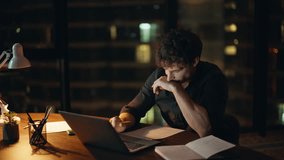 Depressed worker looking laptop at night company workspace closeup. Tired businessman suffer neck pain working at computer late evening. Exhausted freelancer rubbing eyes closing gadget at dark place. - Powered by Shutterstock - Get 15% off with code: PIKWIZARD15