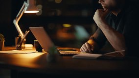 Depressed employee frustrated job problem at night office closeup. Desperate businessman closing laptop feeling stress of overtime work. Nervous entrepreneur disappointed project failure at dark home. - Powered by Shutterstock - Get 15% off with code: PIKWIZARD15