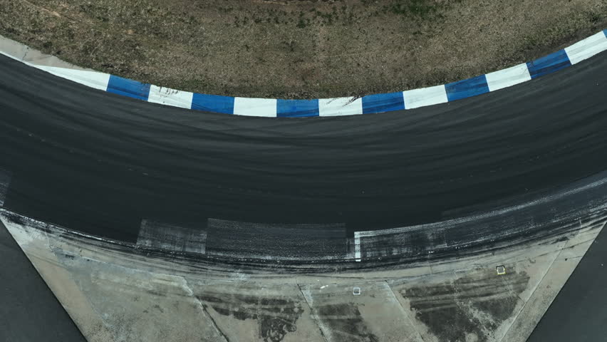 Car drift on asphalt race track with lot of smoke from burning wheel tires rubber, Drift motorsport car drift race, Professional driver drift car on asphalt race track, Car motion blurred motorsport.