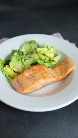 Salmon fried fish seafood dish fresh delicious gourmet food background on the table rustic food top view copy space keto paleo diet vegetarian food pescetarian diet