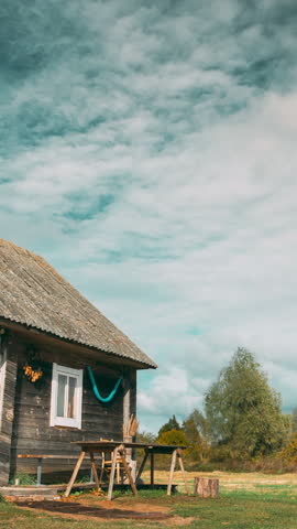Beautiful Rural Landscape. Concept Of Downshifting Lifestyle. 4k Timelapse Summer Colorful Dramatic Sky With Cumulus Clouds Above Old Village House. Time Lapse, Time-lapse. Clouds Above House.