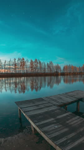 Night Stars Above Lake. Natural Starry Sky Landscape. Wooden Pier. Autumn Forest woods lake . Amazing Landscape Woodland Slider Time Lapse, Time-lapse. reflection on water surface wide angel, tranquil