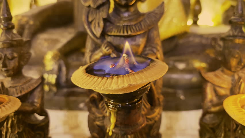 Lights in Lanna Candle Trays are lit to worship the ancient Buddha statue at Wat Pha Lat with a sepia theme. Worshiping Buddha. Sacred things in Buddhism.