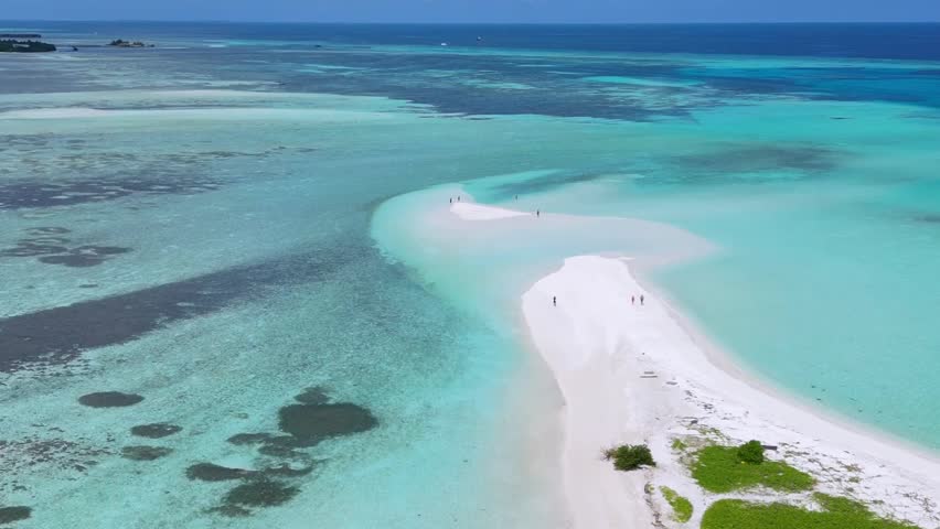 Aerial view of white sandy sandbar near Thulusdhoo island.Maldives.Drone point of view footage.Stunning tropical landscape of Indian Ocean coastline.