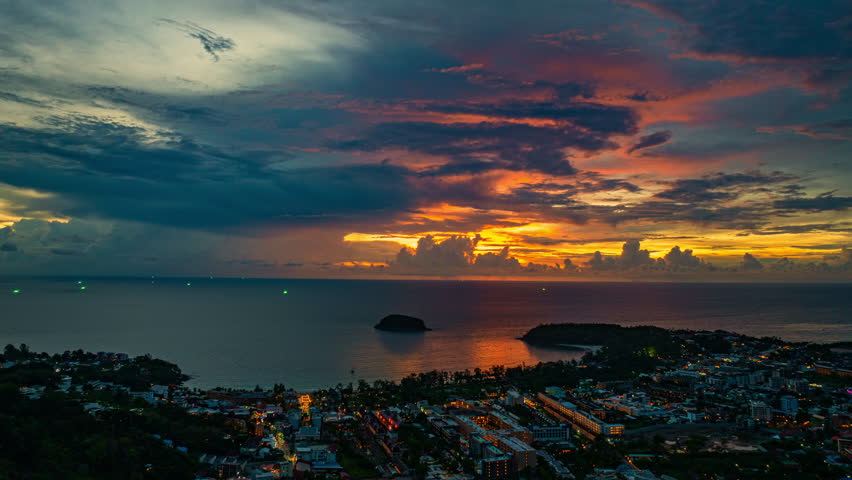Aerial view of A amazing panoramic view of colorful sky over a large fishing port in Phuket. This port is important as a center for large fishing boats. A stunning sunset sky reflected on the water