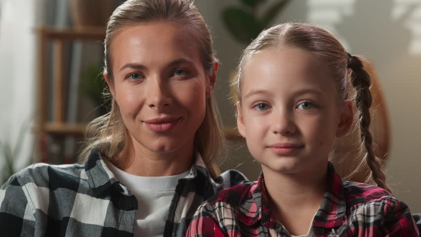 Close up European family Caucasian portrait mother female mom woman babysitter with little child kid girl daughter happy smiling at home custody bonding relationship devotion affectionate childcare