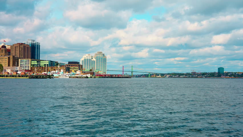 Boat tour exploring Halifax Downtown in Nova Scotia, Canada. Waterfront Skyline of the city. View of the financial district. Sightseeing of Halifax.