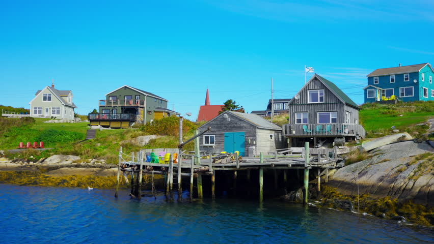 Peggy’s Cove in Nova Scotia, Canada. Charming fishing village with an iconic lighthouse.
Rugged granite rocks, colorful houses, and stunning views of the Atlantic. Peace, history, and natural beauty.