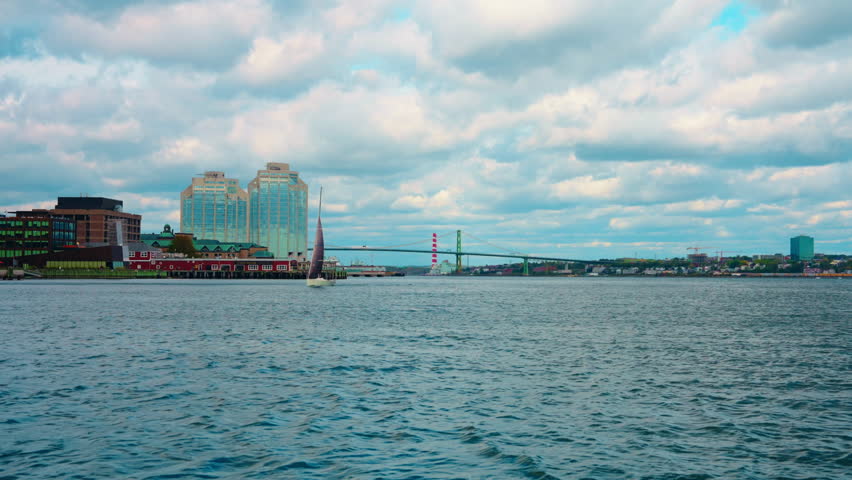 Boat tour exploring Halifax Downtown in Nova Scotia, Canada. Waterfront Skyline of the city. View of the financial district. Sightseeing of Halifax.