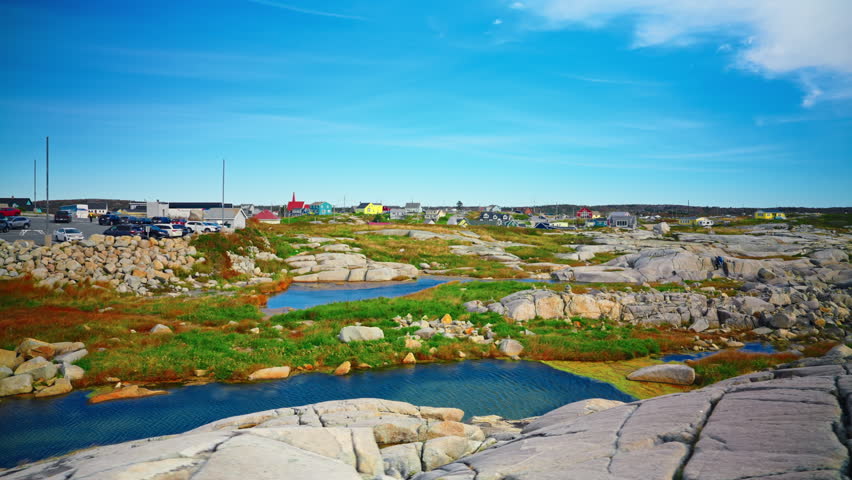 Peggy’s Cove in Nova Scotia, Canada. Charming fishing village with an iconic lighthouse.
Rugged granite rocks, colorful houses, and stunning views of the Atlantic. Peace, history, and natural beauty.