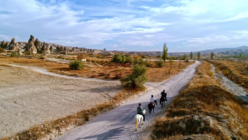 Horseback Riding Group Touring Cappadocia Terrain