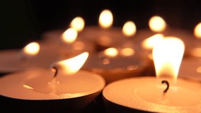 Close-up shot on a macro lens of a tealight candles. Perfect for themes of relaxation, spirituality, remembrance, and holiday decorations. - Powered by Shutterstock - Get 15% off with code: PIKWIZARD15
