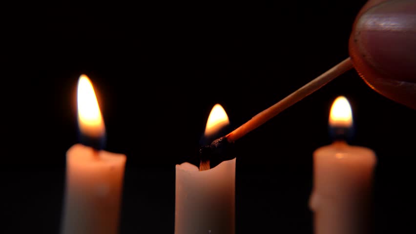 Candlelight Flames Ignited with Matchstick in Dark and Subdued Background. White candle flame - Powered by Shutterstock - Get 15% off with code: PIKWIZARD15