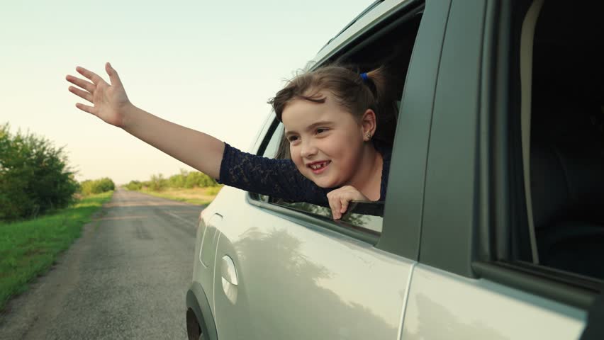 kid child girl looking out car window sunset, open road, thrill, kid girl, free-spirited girl, girl hand out window adventure concept car, rides with wind her face, stretching out into sunset, concept