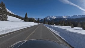 Immersive point of view footage driving through snowy mountain pass in Colorado along US550 aka the Million Dollar Highway in winter - Powered by Shutterstock - Get 15% off with code: PIKWIZARD15