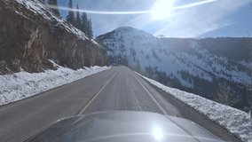 Immersive point of view footage driving through snowy mountain pass in Colorado along US550 aka the Million Dollar Highway in winter - Powered by Shutterstock - Get 15% off with code: PIKWIZARD15