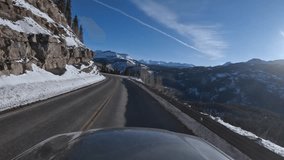 Immersive point of view footage driving through snowy mountain pass in Colorado along US550 aka the Million Dollar Highway in winter - Powered by Shutterstock - Get 15% off with code: PIKWIZARD15
