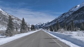 Immersive point of view footage driving through snowy mountain pass in Colorado along US550 aka the Million Dollar Highway in winter - Powered by Shutterstock - Get 15% off with code: PIKWIZARD15