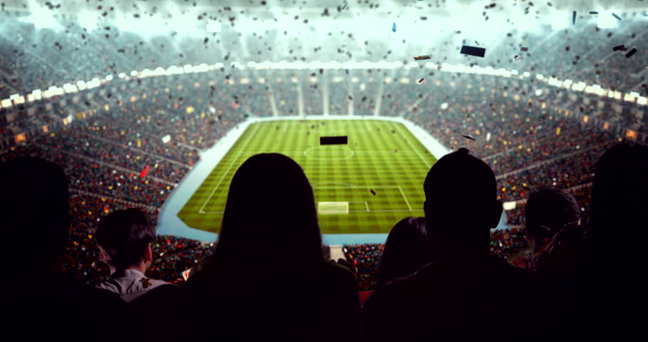4K video of a lively stadium crowd at a nighttime soccer game, cheering confetti under bright stadium lights