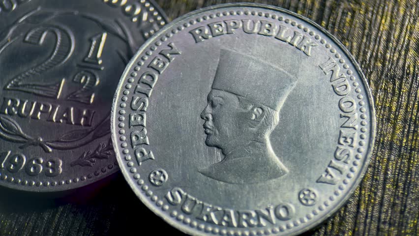 Sukarno pattern coin a 1963 indonesian 2.5 rupiah coin.